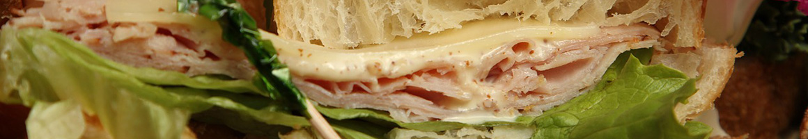 Eating Sandwich at Scarborough Grounds restaurant in Scarborough, ME.